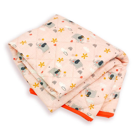 Full view of a coral-colored reversible baby blanket spread out flat, featuring a pattern of gray elephants and cats interspersed with yellow and white floral and abstract designs.