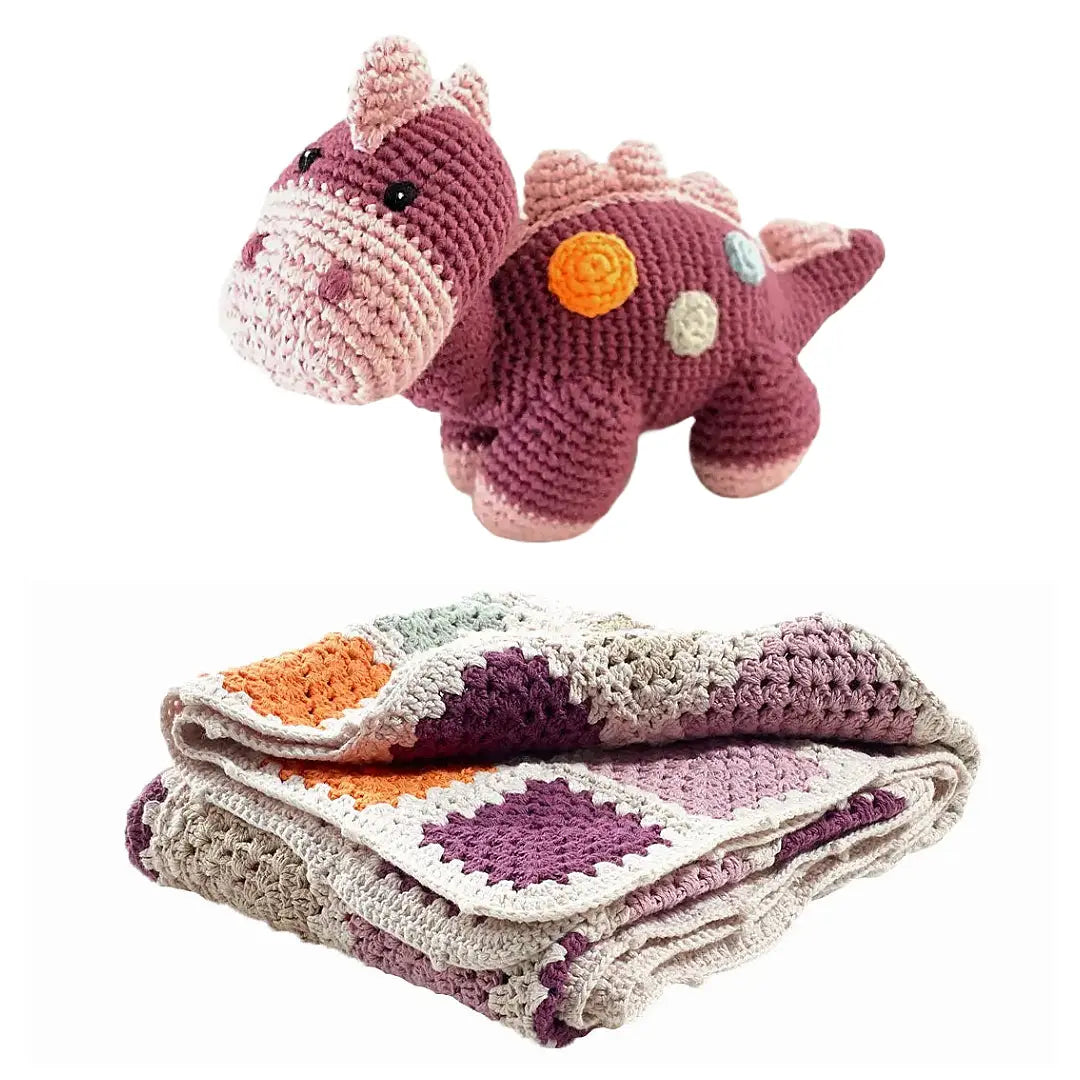 Purple granny square baby blanket and purple dinosaur with gentle rattle. 