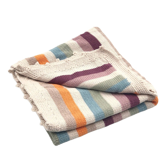 A neatly folded multi-colored striped baby blanket showing layers of stripes in pastel shades including purple, orange, and various blues, highlighted by a soft, textured weave.