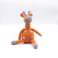 Crocheted toy giraffe on a white background