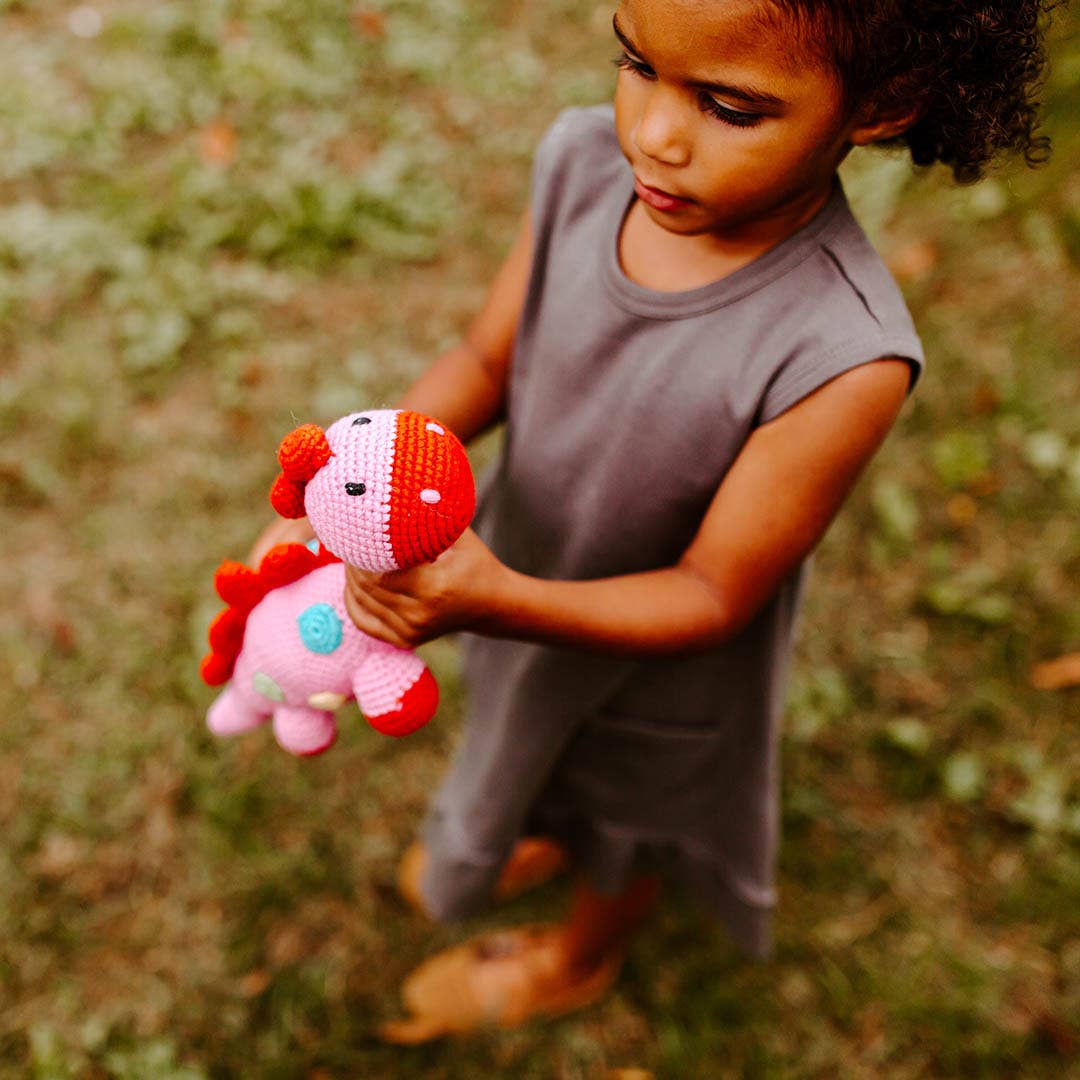 Pebble Handmade Stegosaurus Baby Rattle | Organic Cotton | Pink