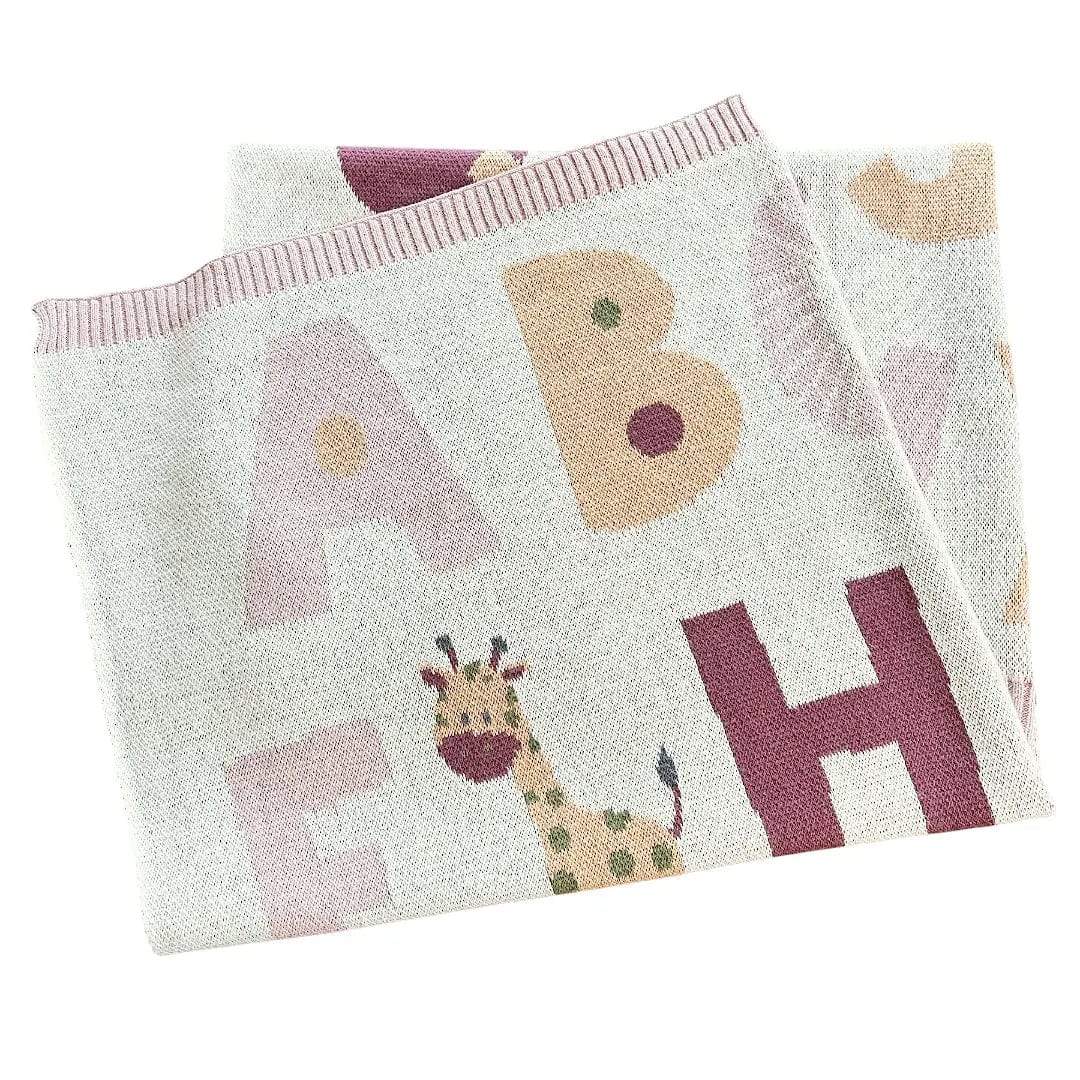 The Baby Blanket Store Crib Blanket 30" x 42" Natural/Pink / One Size Alphabet Pink | Organic  Cotton Jacquard Sweater Knit Baby Blanket