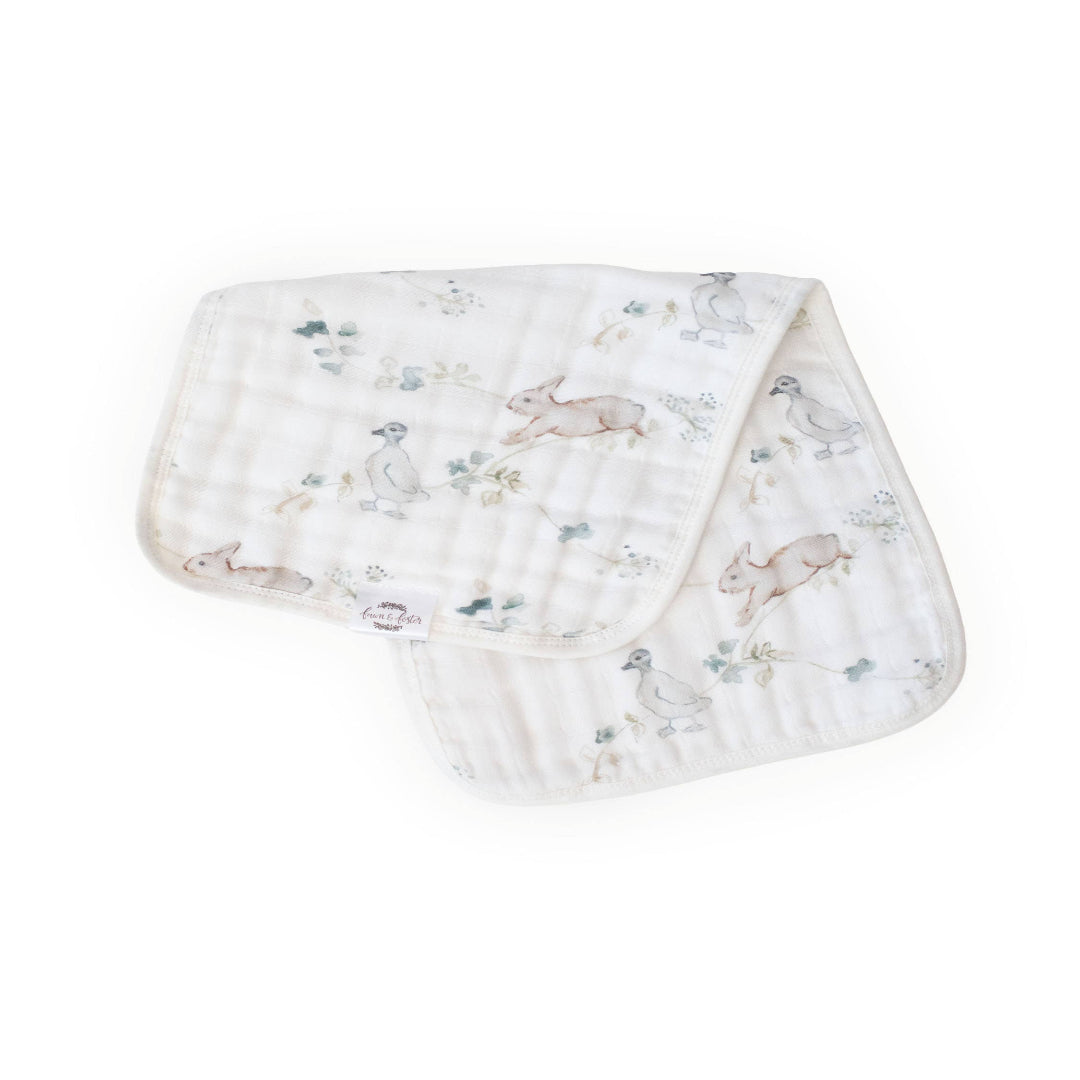 Baby burp cloth with animal pattern on a white background