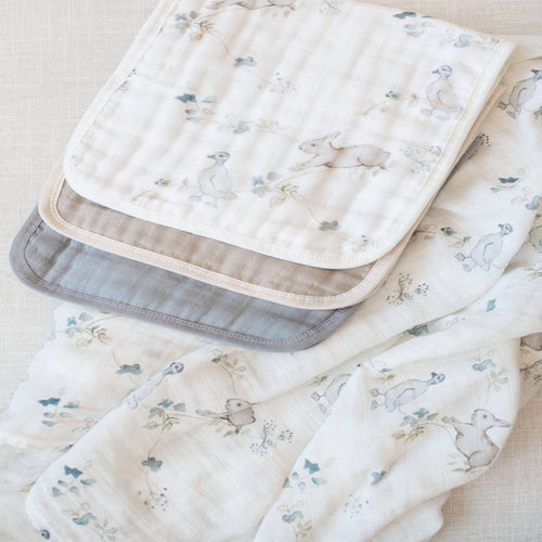 Set of baby blankets with animal prints on a light background